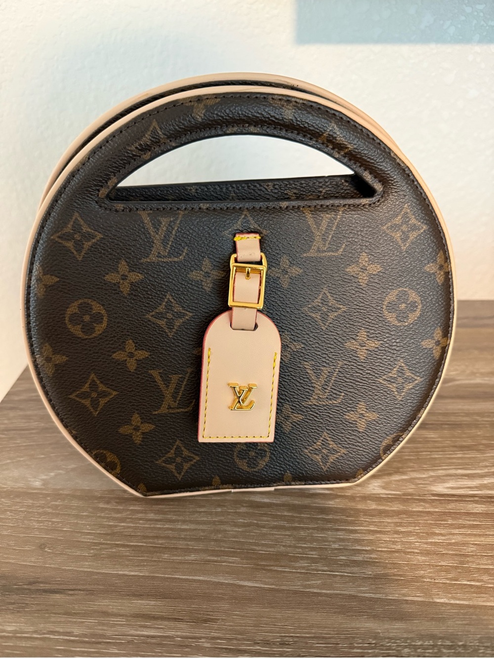 Louis Vuitton Monogram Round Carry Bag in Brown with Natural Leather Trim